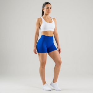 female wearing royal blue shorts and white sports bra
