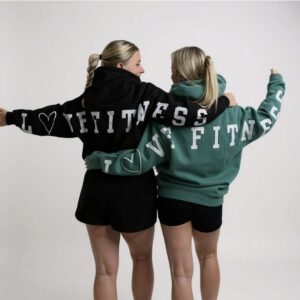 2 females in hoodies tops