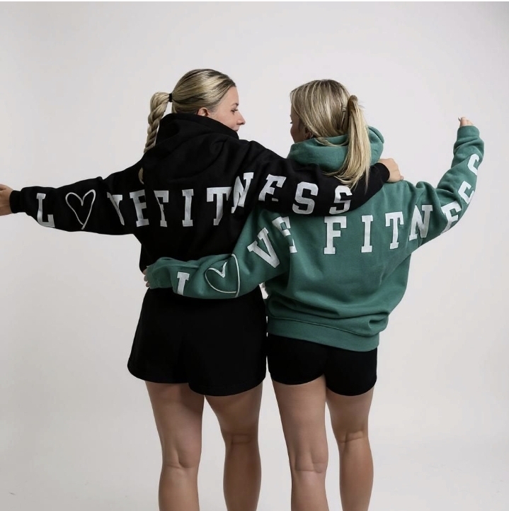 2 females in hoodies tops